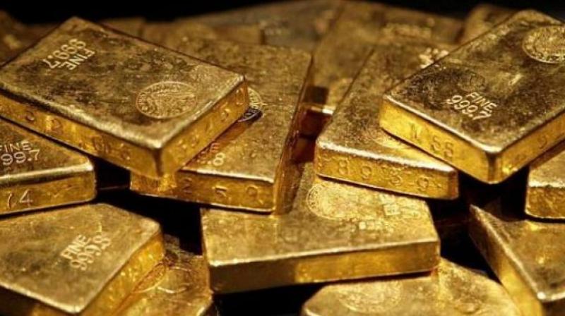 Gold tumbled by Rs 190 to Rs 32,210 per ten gram on a weak overseas trend and falling demand from local jewellers. Gold tumbled by Rs 190 to Rs 32,210 per ten gram on a weak overseas trend and falling demand from local jewellers.
