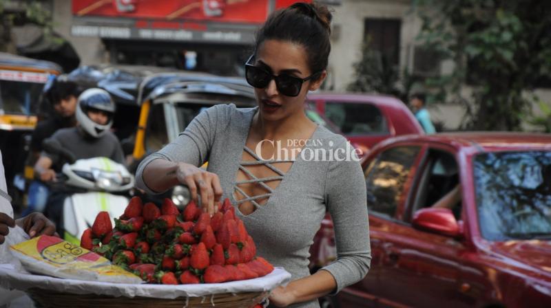 Malaika taking a look at the strawberries. (Photo: Viral Bhayani) Malaika taking a look at the strawberries. (Photo: Viral Bhayani)