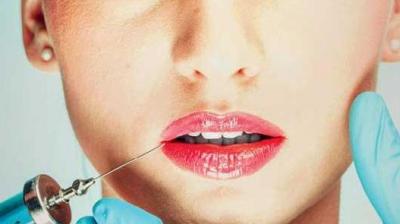 Holt says he wasn’t happy with his natural look and is happy with the fake appearance (Photo: AFP)