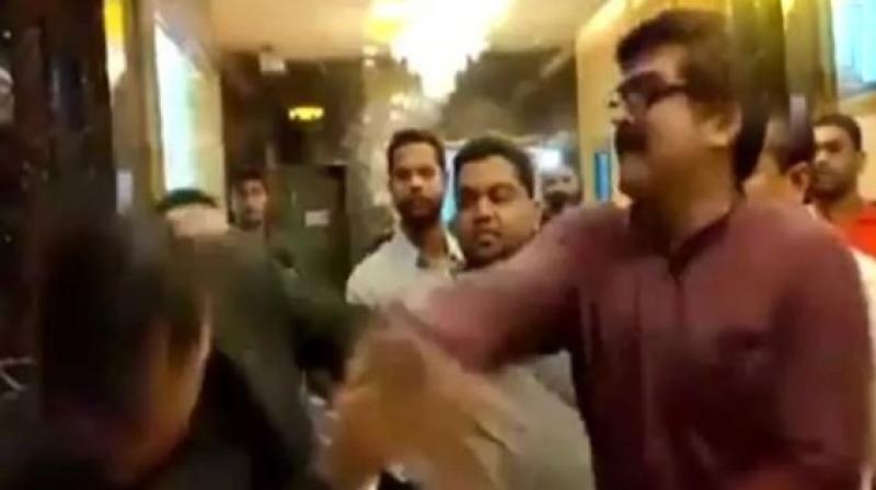 In a video that is being widely circulated on the internet, MNS workers can be seen slapping and abusing the manager. (Photo: Screengrab | ANI) In a video that is being widely circulated on the internet, MNS workers can be seen slapping and abusing the manager. (Photo: Screengrab | ANI)