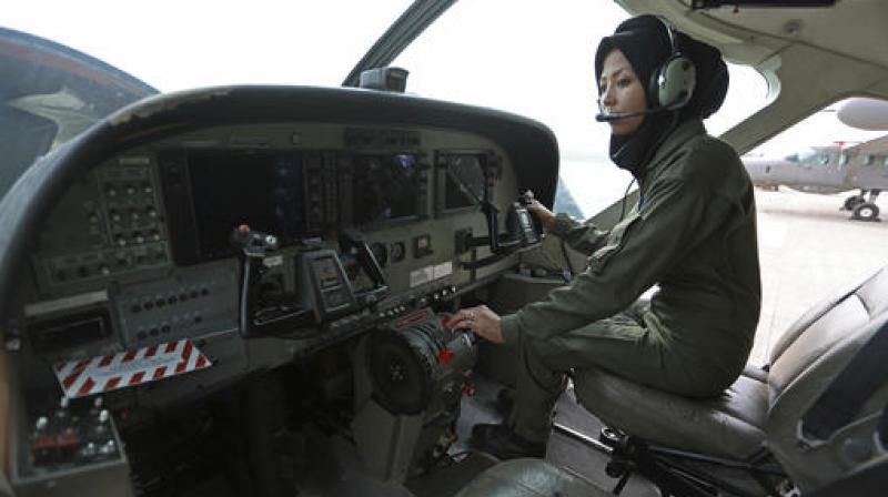 Safia Ferozi, 26, sits in a C-208, a turboprop plane used as transport for the armed forces, before a flight, at the Afghan military airbase in Kabul. (Photo: AP) Safia Ferozi, 26, sits in a C-208, a turboprop plane used as transport for the armed forces, before a flight, at the Afghan military airbase in Kabul. (Photo: AP)