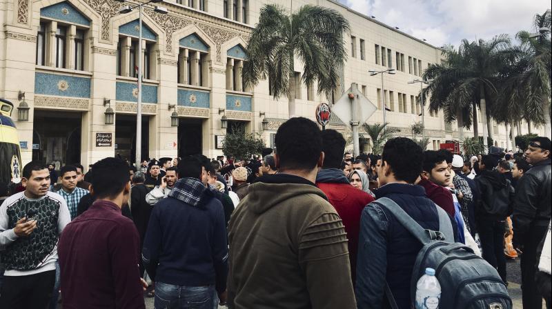 People gather outside Ramsis train station in Cairo. (Photo:AP) People gather outside Ramsis train station in Cairo. (Photo:AP)