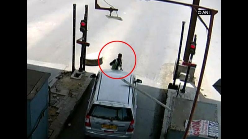 Kumar said he was dragged after he tried to stop the Innova car which collided with the toll barrier and sped away from Kherki Daula toll in Gurugram. (Photo: ANI) Kumar said he was dragged after he tried to stop the Innova car which collided with the toll barrier and sped away from Kherki Daula toll in Gurugram. (Photo: ANI)