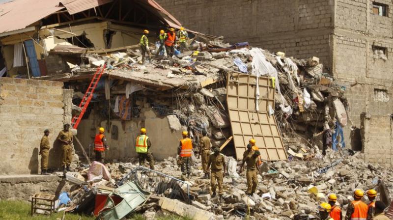 Rescuers work at the site of a building collapse in Nairobi, Kenya Tuesday. Nairobi Police Chief Japheth Koome said Tuesday that at least 10 people had been reported missing after the collapse Monday night. (Photo: AP) Rescuers work at the site of a building collapse in Nairobi, Kenya Tuesday. Nairobi Police Chief Japheth Koome said Tuesday that at least 10 people had been reported missing after the collapse Monday night. (Photo: AP)