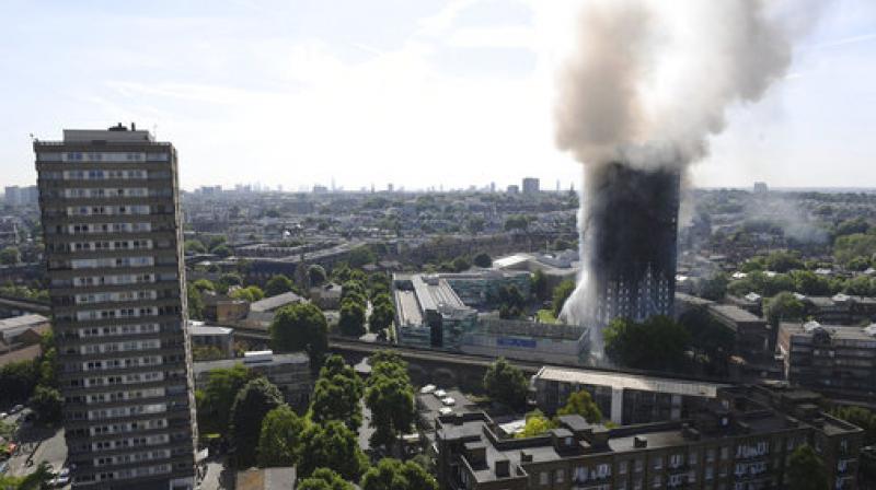 Smoke billows from a fire that has engulfed the 24-storey Grenfell Tower in west London. (Photo: AP) Smoke billows from a fire that has engulfed the 24-storey Grenfell Tower in west London. (Photo: AP)