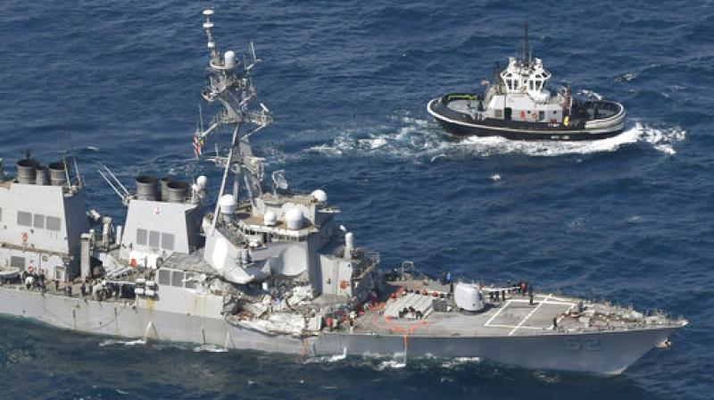 The USS Fitzgerald, left, heads to Yokosuka, home base of the 7th Fleet, beside a U.S. tugboat, off Shimoda, Shizuoka prefecture, Japan, after the Navy destroyer collided with a merchant ship. (Photo: AP) The USS Fitzgerald, left, heads to Yokosuka, home base of the 7th Fleet, beside a U.S. tugboat, off Shimoda, Shizuoka prefecture, Japan, after the Navy destroyer collided with a merchant ship. (Photo: AP)