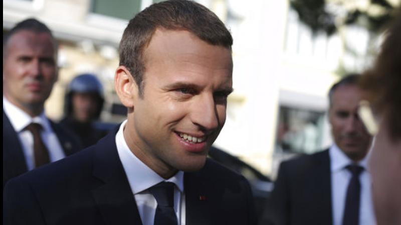French President Emmanuel Macron meets peoples he leaves his house before voting in the final round of parliamentary elections, in the northern seaside town of Le Touquet, France. (Photo: AP) French President Emmanuel Macron meets peoples he leaves his house before voting in the final round of parliamentary elections, in the northern seaside town of Le Touquet, France. (Photo: AP)