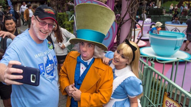 Jeff Reitz clicks a selfie with the Mad Hatter and Alice after a teacup ride at the Mad Tea Party in Fantasyland at Disneyland on June 22, 2017, during his 2,000th visit to the park in Anaheim, California. (Photo: AFP) Jeff Reitz clicks a selfie with the Mad Hatter and Alice after a teacup ride at the Mad Tea Party in Fantasyland at Disneyland on June 22, 2017, during his 2,000th visit to the park in Anaheim, California. (Photo: AFP)