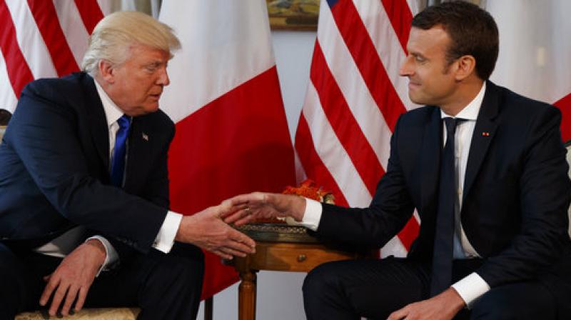 US President Donald Trump, shaking hands with French President, Emmanuel Macron, during a meeting at the US Embassy in Brussels. (Photo: AP) US President Donald Trump, shaking hands with French President, Emmanuel Macron, during a meeting at the US Embassy in Brussels. (Photo: AP)