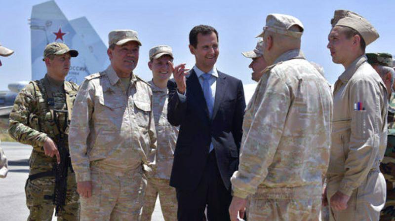 Syrian President Bashar Assad inspects with the Russian Army's Chief of Staff, Gen. Valery Gerasimov, the Russian Hmeimim air base in the province of Latakia, Syria. (Photo: AP) Syrian President Bashar Assad inspects with the Russian Army's Chief of Staff, Gen. Valery Gerasimov, the Russian Hmeimim air base in the province of Latakia, Syria. (Photo: AP)