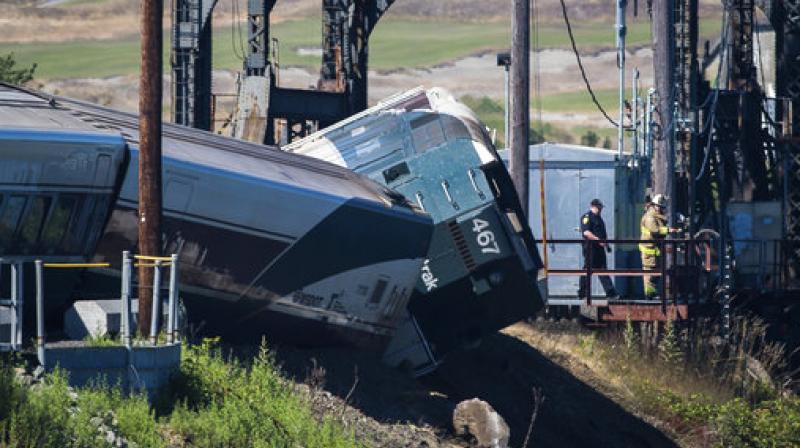 Emergency crews respond to the scene of a train derailment near Chambers Bay on Sunday, July 2, 2017, in Tacoma, Wash. There appear to be only minor injuries from the waterfront derailment of the Amtrak Cascades train near the town of Steilacoom, the Pierce County Sheriff's Office said on Twitter. The train runs between Vancouver, Canada, and Eugene-Springfield, Oregon. (Photo: AP) Emergency crews respond to the scene of a train derailment near Chambers Bay on Sunday, July 2, 2017, in Tacoma, Wash. There appear to be only minor injuries from the waterfront derailment of the Amtrak Cascades train near the town of Steilacoom, the Pierce County Sheriff's Office said on Twitter. The train runs between Vancouver, Canada, and Eugene-Springfield, Oregon. (Photo: AP)