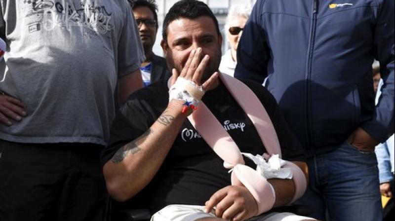 Hassan Zubier wipes his face as he visits Turku Market Square in Turku, Finland. Zubier was injured in the mass stabbing in Turku on Friday Aug. 18 as he attempted to help a stabbing victim. The knife attack in western Finland that left two people dead and several wounded is "a likely terror act," Finland's intelligence agency said Saturday, while police said Europol was investigating if it had any ties to deadly vehicle attacks in Spain. (Photo: AP) Hassan Zubier wipes his face as he visits Turku Market Square in Turku, Finland. Zubier was injured in the mass stabbing in Turku on Friday Aug. 18 as he attempted to help a stabbing victim. The knife attack in western Finland that left two people dead and several wounded is "a likely terror act," Finland's intelligence agency said Saturday, while police said Europol was investigating if it had any ties to deadly vehicle attacks in Spain. (Photo: AP)