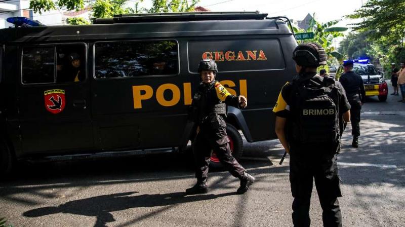 Police officers stand guard near the site where an explosion went off at Santa Maria church in Surabaya, East Java, Indonesia. (Photo: AFP) Police officers stand guard near the site where an explosion went off at Santa Maria church in Surabaya, East Java, Indonesia. (Photo: AFP)