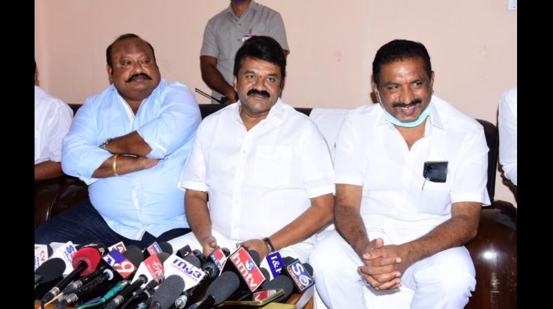 Korutla MLA K. Vidya Sagar Rao addressing a meeting on Thursday. Ministers T. Srinivas Yadav and Koppula Eshwar are also seen.   DC Image