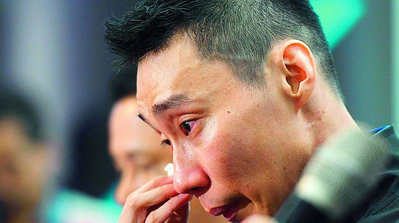 Malaysia’s badminton player Lee Chong Wei reacts during a press conference to announce his retirement in Putrajaya on Thursday. (Photo: AFP) Malaysia’s badminton player Lee Chong Wei reacts during a press conference to announce his retirement in Putrajaya on Thursday. (Photo: AFP)