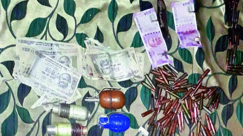 New currency notes of `2,000 denomination recovered from militants killed in Bandipora district of North Kashmir on Tuesday. (Photo: PTI ) New currency notes of `2,000 denomination recovered from militants killed in Bandipora district of North Kashmir on Tuesday. (Photo: PTI )