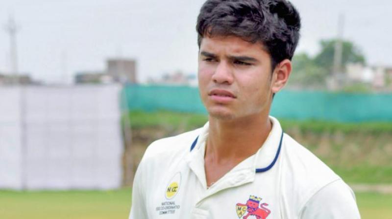 Sporting an orange t-shirt, Arjun could be seen bowling to England batsmen under the watchful eyes of the team's spin bowling consultant, Saqlain Mushtaq. (Photo: PTI) Sporting an orange t-shirt, Arjun could be seen bowling to England batsmen under the watchful eyes of the team's spin bowling consultant, Saqlain Mushtaq. (Photo: PTI)