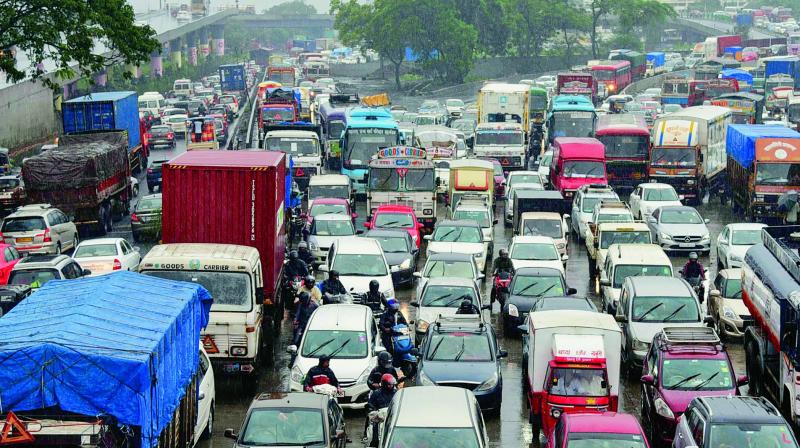 Vehicles stuck in a traffic congestion on Sion-Panvel highway due to rains, in Mumbai on Thursday. (PTI) Vehicles stuck in a traffic congestion on Sion-Panvel highway due to rains, in Mumbai on Thursday. (PTI)