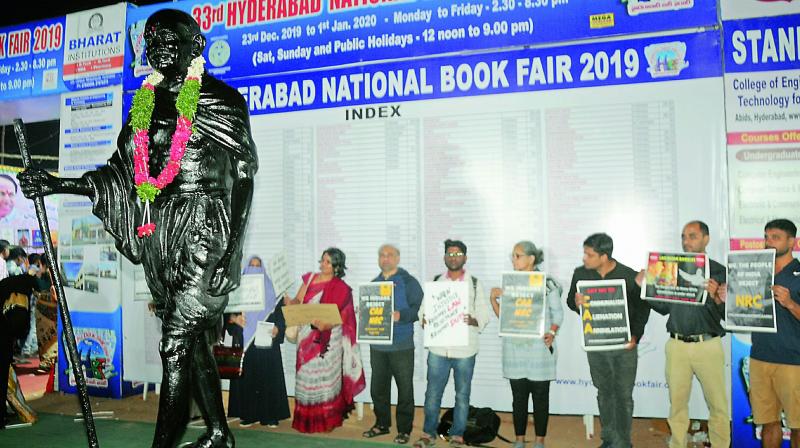 A group of people protests against the CAA and the NRC at the Hyderabad Book Fair on Saturday. (Photo: Deepak Deshpande) A group of people protests against the CAA and the NRC at the Hyderabad Book Fair on Saturday. (Photo: Deepak Deshpande)