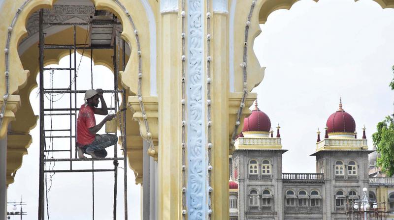 Mysuru Palace gets a fresh coat of paint on Sunday ahead of the Dasara festivities. Mysuru Palace gets a fresh coat of paint on Sunday ahead of the Dasara festivities.