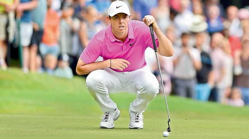 Northern Irelands Rory McIlroy lines up his putt PGA Championship at Wentworth Golf Club in Surrey, south west of London. AP File Photo