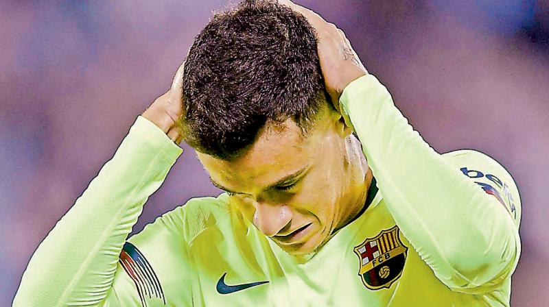 Philippe Coutinho reacts after missing a scoring opportunity. AFP Photo