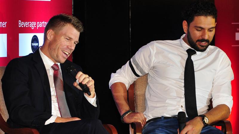 David Warner and Yuvraj Singh share the stage for an interaction session at the VVS Laxman Foundation event in Hyderabad. DC File Photo