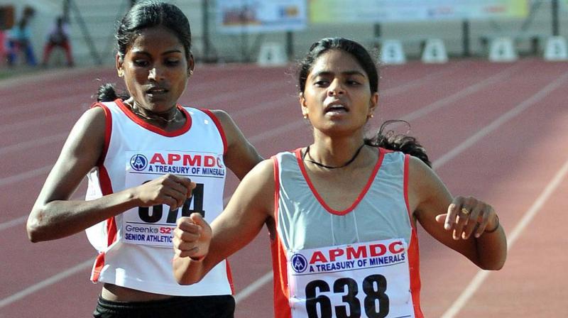 Jharkhand's Jhuma Khatun (R) en route to gold in the women's 1500 metres race at Senior National Inter-State Championships in Hyderabad. DC Photo Jharkhand's Jhuma Khatun (R) en route to gold in the women's 1500 metres race at Senior National Inter-State Championships in Hyderabad. DC Photo