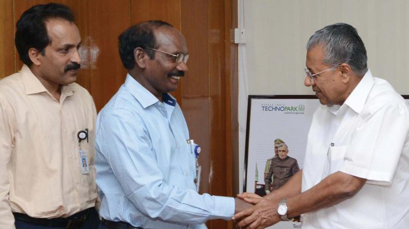 Indian Space Research Organisation chairman Dr. K. Sivan being greeted by Chief Minister Pinarayi Vijayan on his arrival at CM’s office in Secretariat in Thiruvananthapuram on Saturday. Mr Sivan handed over to the Chief Minister a cheque of `16.68 lakh towards the Ockhi fund. Also seen is Vikram Sarabhai Space Centre director S. Somanath. (Photo: DC) Indian Space Research Organisation chairman Dr. K. Sivan being greeted by Chief Minister Pinarayi Vijayan on his arrival at CM’s office in Secretariat in Thiruvananthapuram on Saturday. Mr Sivan handed over to the Chief Minister a cheque of `16.68 lakh towards the Ockhi fund. Also seen is Vikram Sarabhai Space Centre director S. Somanath. (Photo: DC)