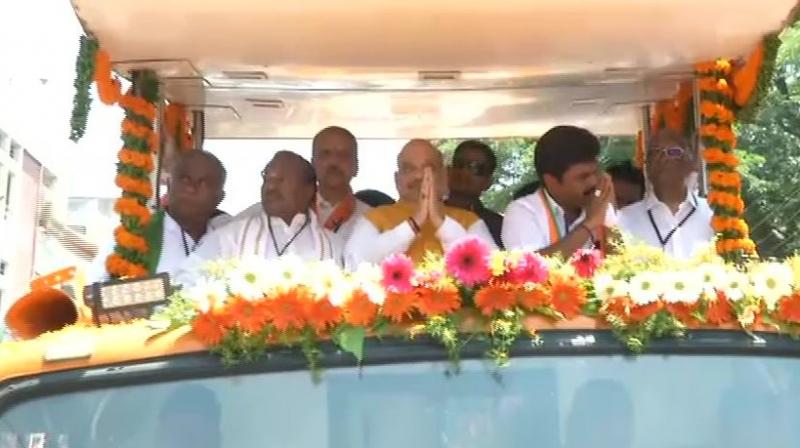 Thousands of people had gathered all along the route showering flower petals on Shah as the vehicle wound its way in a delirious atmosphere. (Image: ANI twitter) Thousands of people had gathered all along the route showering flower petals on Shah as the vehicle wound its way in a delirious atmosphere. (Image: ANI twitter)