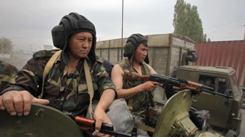 Kyrgyz Army soldiers are alert atop an armored personal carrier patrolling the outskirts of the southern Kyrgyz city of Osh in Kyrgyzstan. (Photo: AP) Kyrgyz Army soldiers are alert atop an armored personal carrier patrolling the outskirts of the southern Kyrgyz city of Osh in Kyrgyzstan. (Photo: AP)