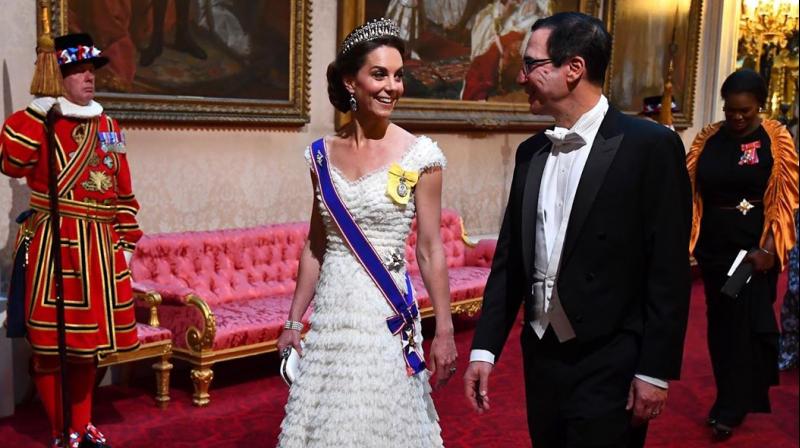 The Duchess wore a blue, red and white sash of the Royal Victorian Order on her shoulder over her stunning white Alexander McQueen gown, marking the first time ever she has worn the new honour. (Photo: AP) The Duchess wore a blue, red and white sash of the Royal Victorian Order on her shoulder over her stunning white Alexander McQueen gown, marking the first time ever she has worn the new honour. (Photo: AP)