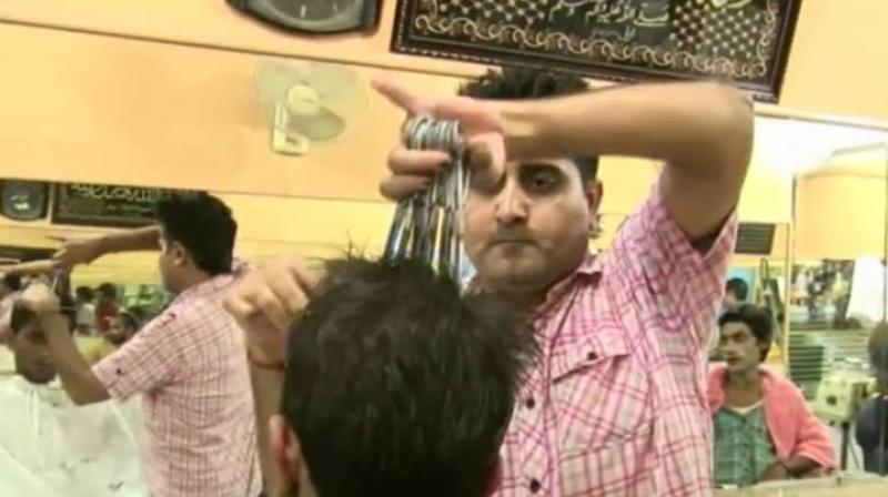 The barber charges close to Rs 100 for a 20 minute haircut (Photo: YouTube) The barber charges close to Rs 100 for a 20 minute haircut (Photo: YouTube)