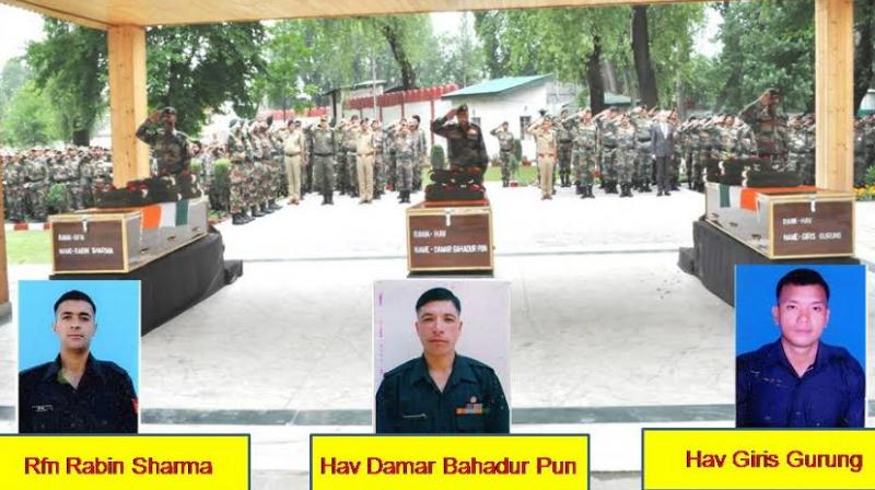 15 Corps Commander Lt Gen JS Sandhu paying tributes to Rifleman Rabin Sharma, Havaldar Damar Bahadur Pun and Havaldar Giris Gurung, at a wreath laying ceremony at 15 Corps headquarters in Srinagar. (Photo: PTI) 15 Corps Commander Lt Gen JS Sandhu paying tributes to Rifleman Rabin Sharma, Havaldar Damar Bahadur Pun and Havaldar Giris Gurung, at a wreath laying ceremony at 15 Corps headquarters in Srinagar. (Photo: PTI)