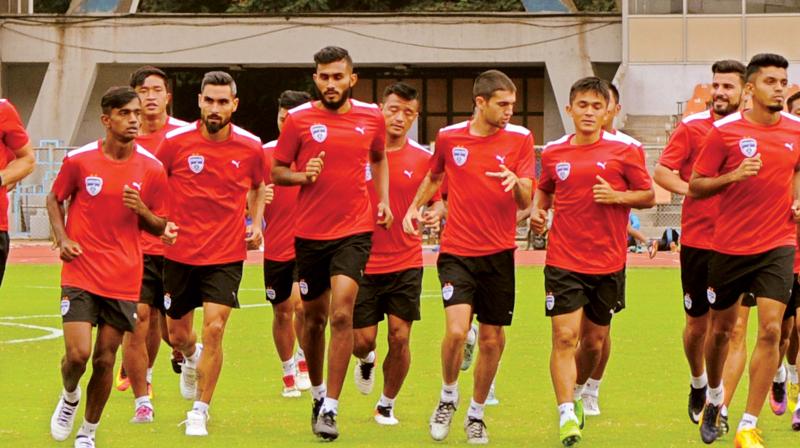 Bengaluru FC players warm up during a training session at Sree Kanteerava Stadium in Bengaluru on Tuesday.(Photo: R. SAMUEL) Bengaluru FC players warm up during a training session at Sree Kanteerava Stadium in Bengaluru on Tuesday.(Photo: R. SAMUEL)