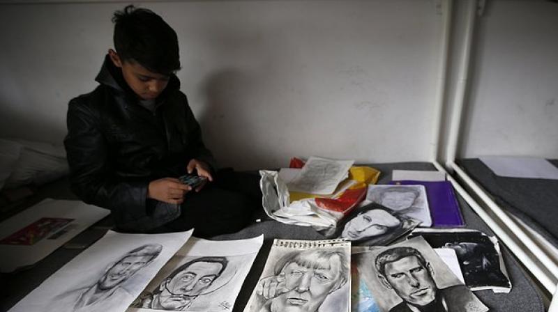 Among Nouri's works exhibited in the garden of a Belgrade cafe were his drawings of Pablo Picasso, Salvador Dali and Harry Potter. (Photo: AP) Among Nouri's works exhibited in the garden of a Belgrade cafe were his drawings of Pablo Picasso, Salvador Dali and Harry Potter. (Photo: AP)