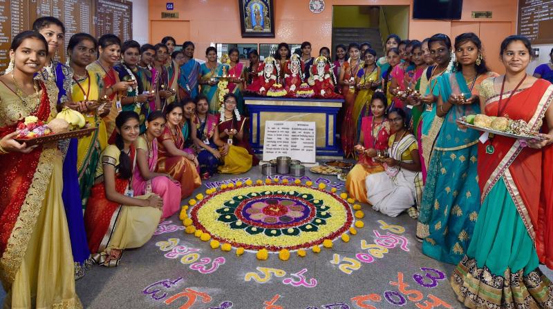 Girls of a college create a rangoli to celebrate Ugadi festival at a college in Chennai on Saturday. (Photo: PTI) Girls of a college create a rangoli to celebrate Ugadi festival at a college in Chennai on Saturday. (Photo: PTI)