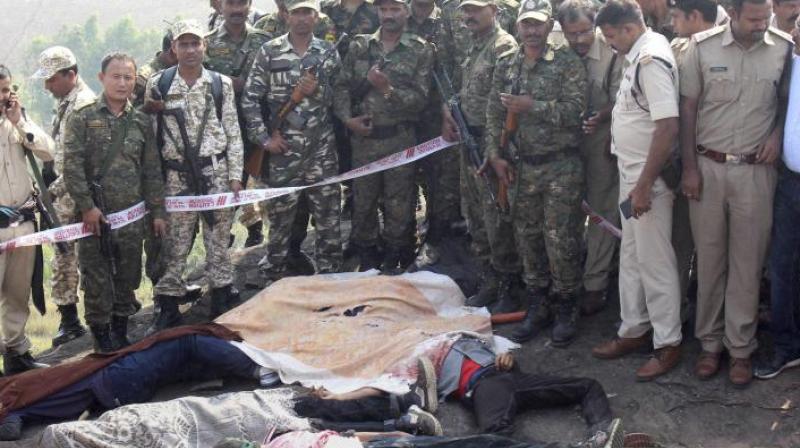 Police investigate the encounter site at the hillocks of Acharpura village after the STF killed 8 Students of Islamic Movement of India (SIMI). (Photo: PTI) Police investigate the encounter site at the hillocks of Acharpura village after the STF killed 8 Students of Islamic Movement of India (SIMI). (Photo: PTI)