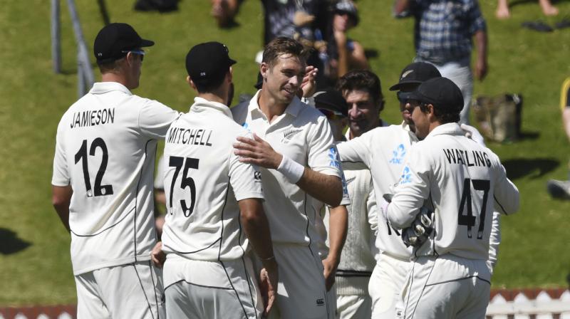 New Zealands Tim Southee is congratulated by team mates after taking the final wicket of Indias Jasprit Bumrah during the first cricket Test between India and New Zealand at the Basin Reserve in Wellington, New Zealand, February 24, 2020. New Zealand defeated India by ten wickets. (AP)