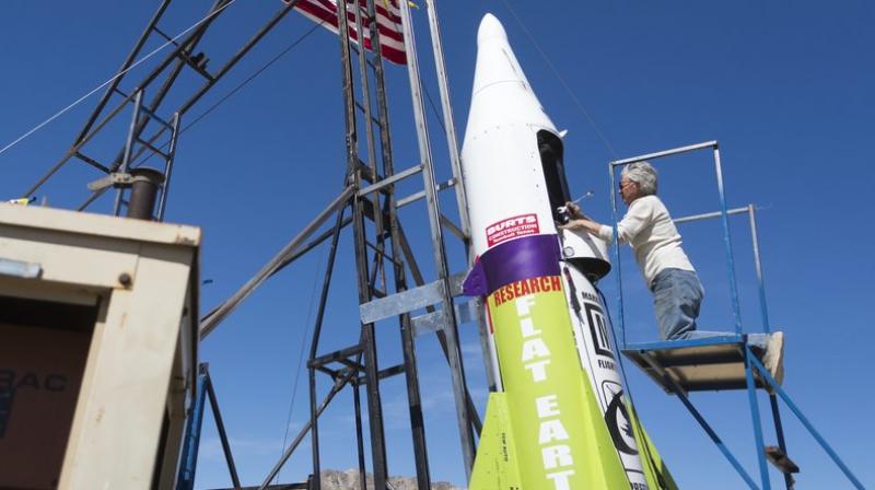 This file photo shows, “Mad” Mike Hughes begins work on repairing a steam leak after he scrubbed his launch attempt of his steam-powered rocket near Amboy, Calif. (James Quigg/Daily Press via AP, File) This file photo shows, “Mad” Mike Hughes begins work on repairing a steam leak after he scrubbed his launch attempt of his steam-powered rocket near Amboy, Calif. (James Quigg/Daily Press via AP, File)