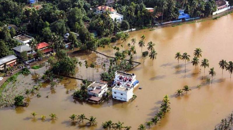 An aerial view of the flooded locality of Aluva after heavy rains, in Kerala (Photo: PTI) An aerial view of the flooded locality of Aluva after heavy rains, in Kerala (Photo: PTI)