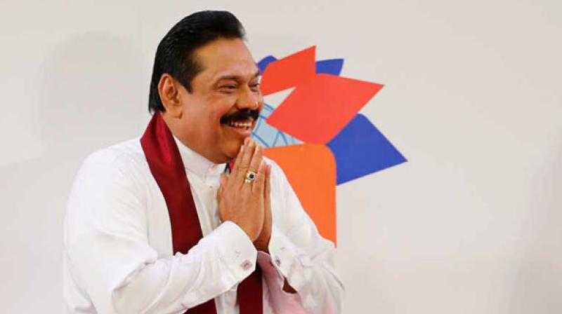 A mustachioed man usually dressed in a spotless white shirt, sarong and trademark maroon sash, Rajapaksa is seen as a hero by many in Sri Lanka's Buddhist majority. He wears rings as lucky charms, sometimes as many as eight, and he has been called the 'lord of the rings'. (Photo: File) A mustachioed man usually dressed in a spotless white shirt, sarong and trademark maroon sash, Rajapaksa is seen as a hero by many in Sri Lanka's Buddhist majority. He wears rings as lucky charms, sometimes as many as eight, and he has been called the 'lord of the rings'. (Photo: File)