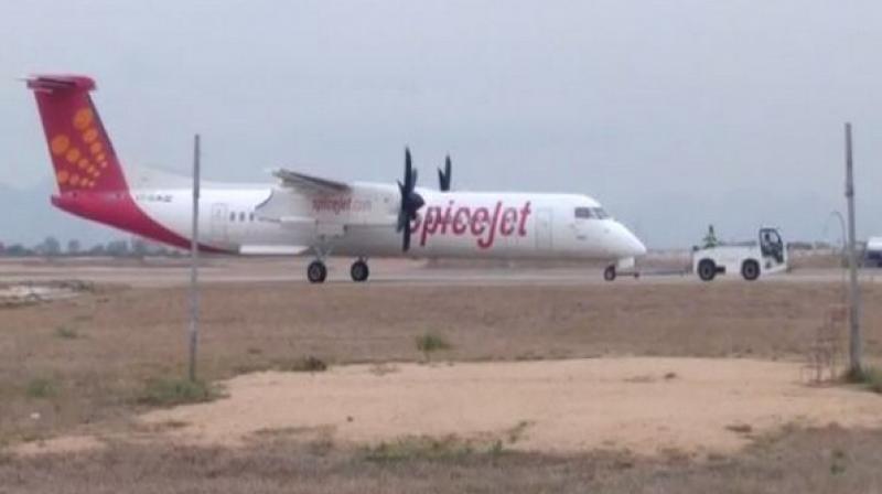 The flight being taken off the runway by airport authorities. (Photo: ANI) The flight being taken off the runway by airport authorities. (Photo: ANI)