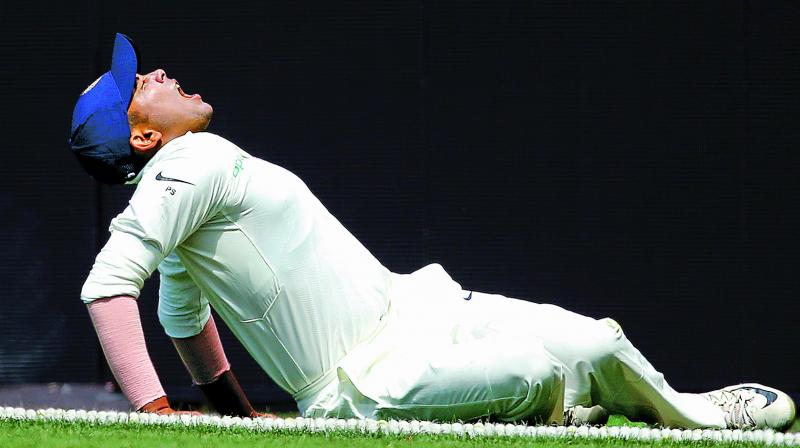 Prithvi Shaw grimaces in pain after injuring his ankle during a warm-up game in Sydney. (AP) Prithvi Shaw grimaces in pain after injuring his ankle during a warm-up game in Sydney. (AP)