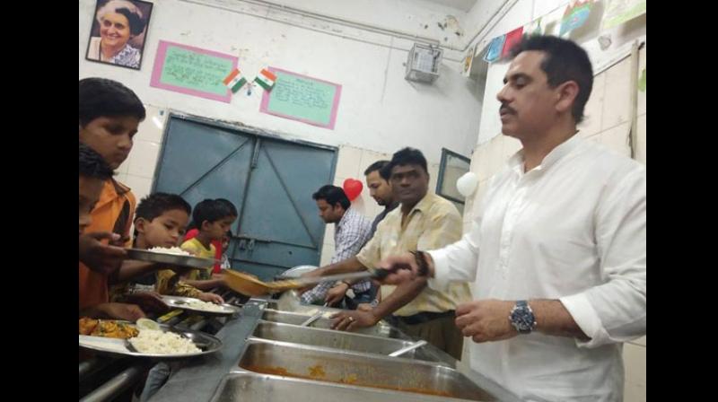 UPA chairperson Sonia Gandhi's son-in-law Robert Vadra kickstarted his birthday week celebrations at an NGO where he spent time with children, the elderly and the poor, among others. (Photo: ANI) UPA chairperson Sonia Gandhi's son-in-law Robert Vadra kickstarted his birthday week celebrations at an NGO where he spent time with children, the elderly and the poor, among others. (Photo: ANI)