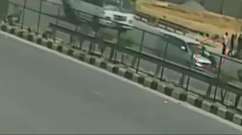 A car driver dragged a toll plaza employee for a long 5-6 km on his car's bonnet at the speed of about 100km/hr in Gurugram when asked to stop at toll plaza on Saturday. (Photo: Screengrab) A car driver dragged a toll plaza employee for a long 5-6 km on his car's bonnet at the speed of about 100km/hr in Gurugram when asked to stop at toll plaza on Saturday. (Photo: Screengrab)