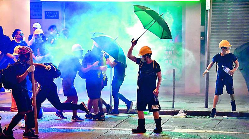 During demonstrations on Saturday, a protester threw the Chinese national flag into the sea after removing it from near a building in Tsim Sha Tsui. (Photo: Representational) During demonstrations on Saturday, a protester threw the Chinese national flag into the sea after removing it from near a building in Tsim Sha Tsui. (Photo: Representational)