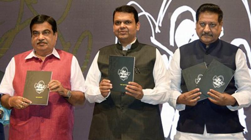 Union Minister Nitin Gadkari, Maharashtra Chief Minister Devendra Fadnavis and former Maharashtra CM Prithviraj Chavan (R) during a book launch function at YB Chavan Center in South Mumbai on Monday. (Photo: PTI) Union Minister Nitin Gadkari, Maharashtra Chief Minister Devendra Fadnavis and former Maharashtra CM Prithviraj Chavan (R) during a book launch function at YB Chavan Center in South Mumbai on Monday. (Photo: PTI)