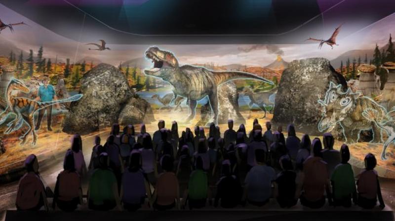 This undated artist rendering provided by BASE Hologram shows a prototype three-dimensional hologram display for a dinosaur exhibit. Horner and entertainment company Base Hologram are aiming to have multiple traveling exhibits ready to launch in spring 2018. (BASE Hologram via AP) This undated artist rendering provided by BASE Hologram shows a prototype three-dimensional hologram display for a dinosaur exhibit. Horner and entertainment company Base Hologram are aiming to have multiple traveling exhibits ready to launch in spring 2018. (BASE Hologram via AP)