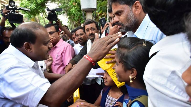Chief Minister H D Kumaraswamy meets students of Alaghatta government school. (Photo: Facebook screengrab/Namma HDK) Chief Minister H D Kumaraswamy meets students of Alaghatta government school. (Photo: Facebook screengrab/Namma HDK)
